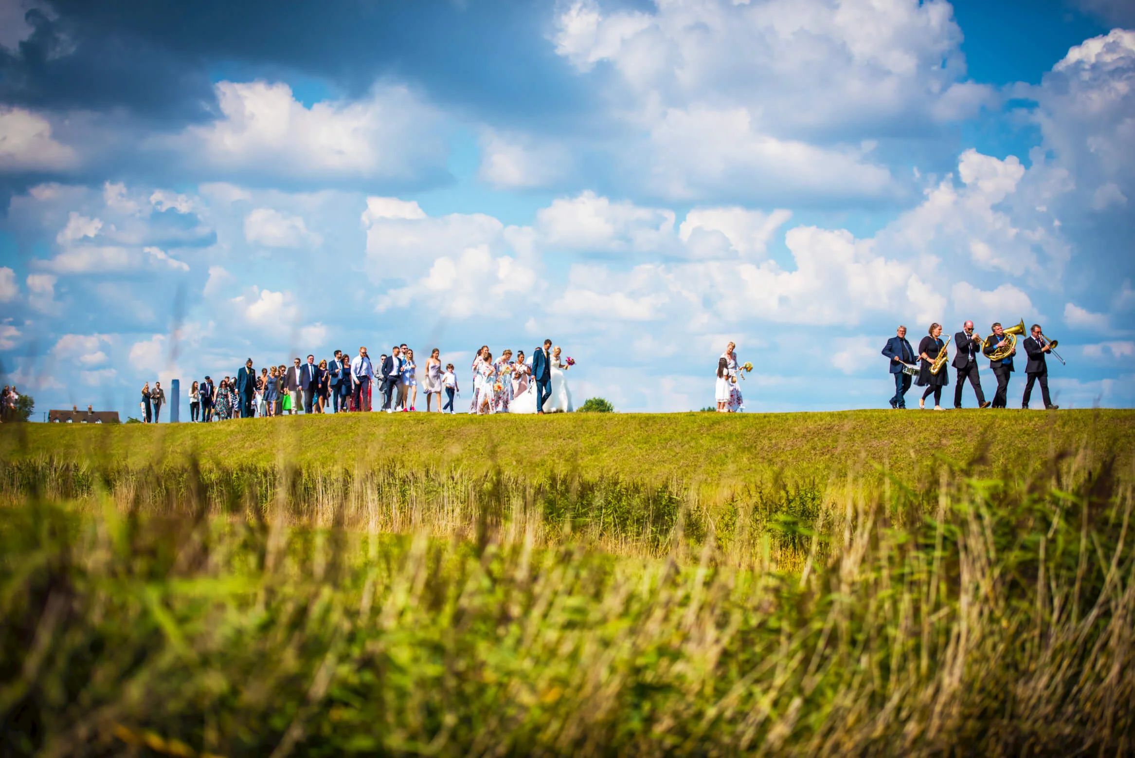 brass-junkies-new-orleans-style-brass-band-outside-being-followed-by-wedding-guests-live-music.jpg