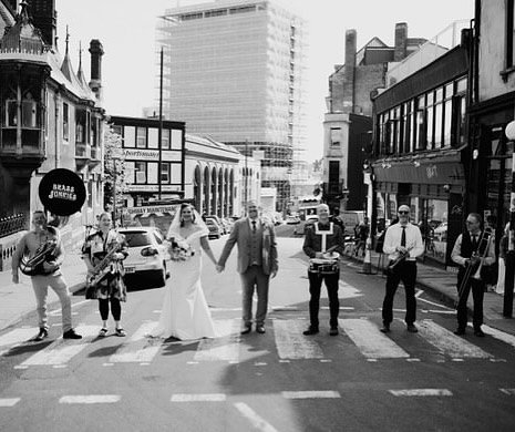 Love this photo! 
Stopping traffic for this wedding shot in #bristol last summer. 
Photo by @alexevansphotography_ featuring @theladybenson and @brassjunkiesbrassband 
#thehappycouple #herecomesthebride #weddingphoto #brassband #brassjunkies #brassju