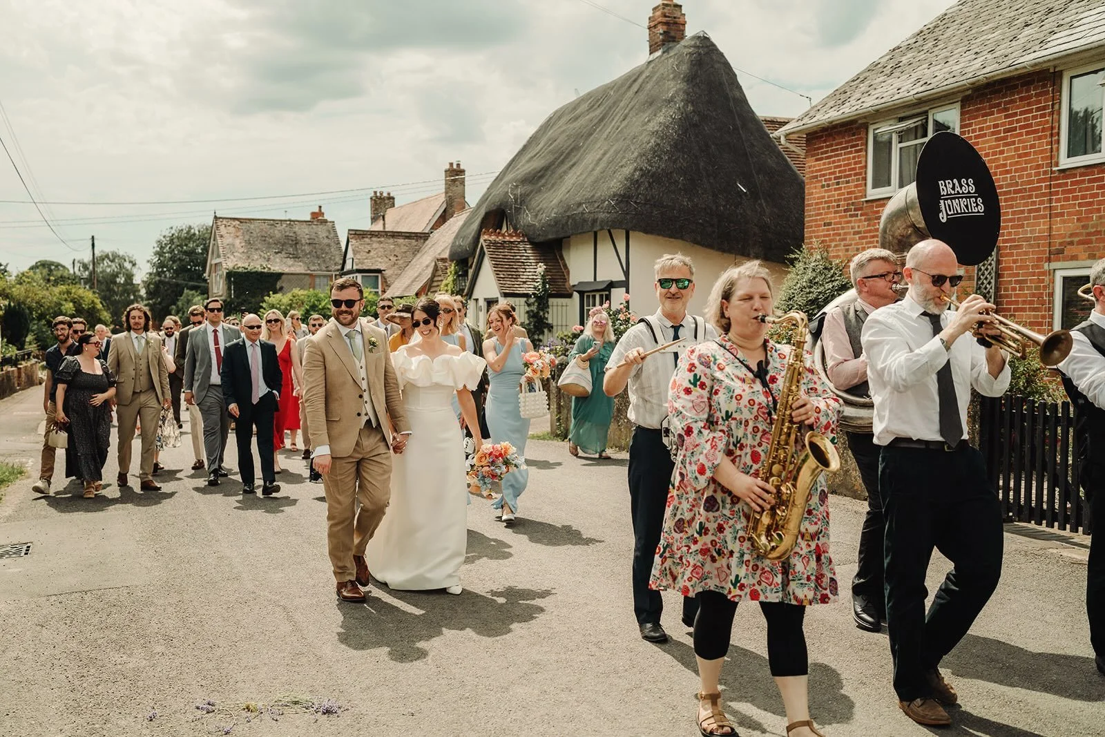 Remembering a very hot and sunny day back in June and a very jolly wedding parade from the church to the reception venue for Izzy &amp; Andy&rsquo;s big day! 
📸 by @charliebritzphotography 
#brassjunkies
#brassjunkiesbrassband 
#weddingbrassband 
#s