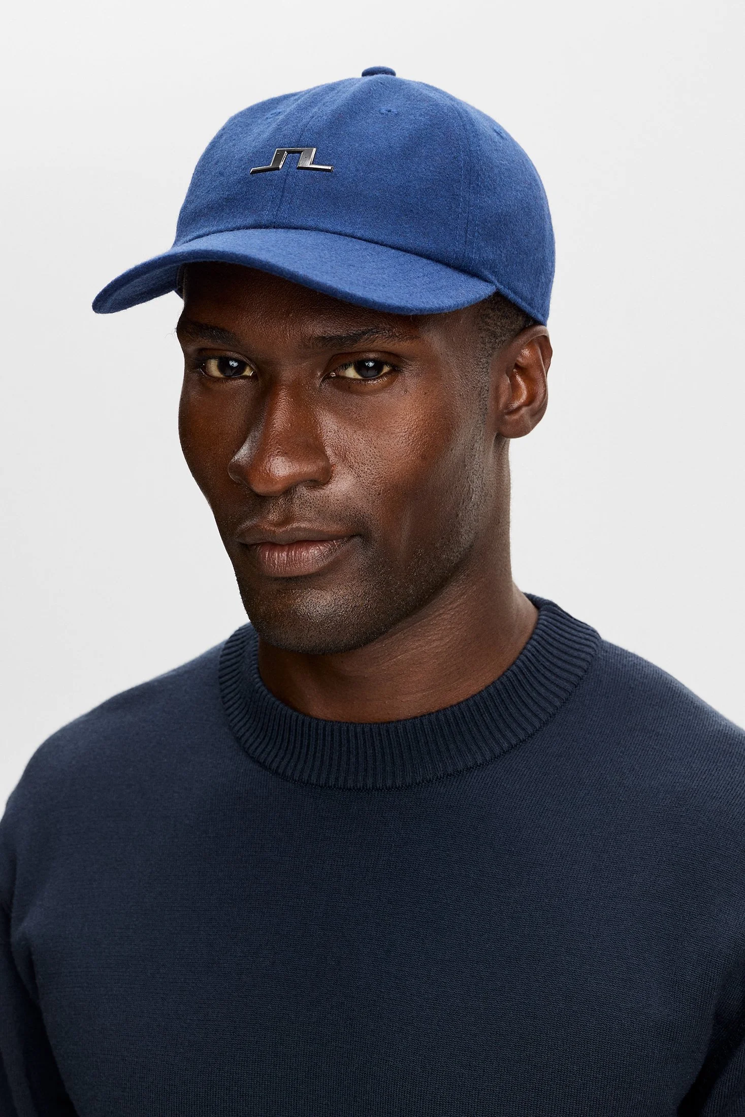 Front View of Model in J Lindeberg Cap in Navy