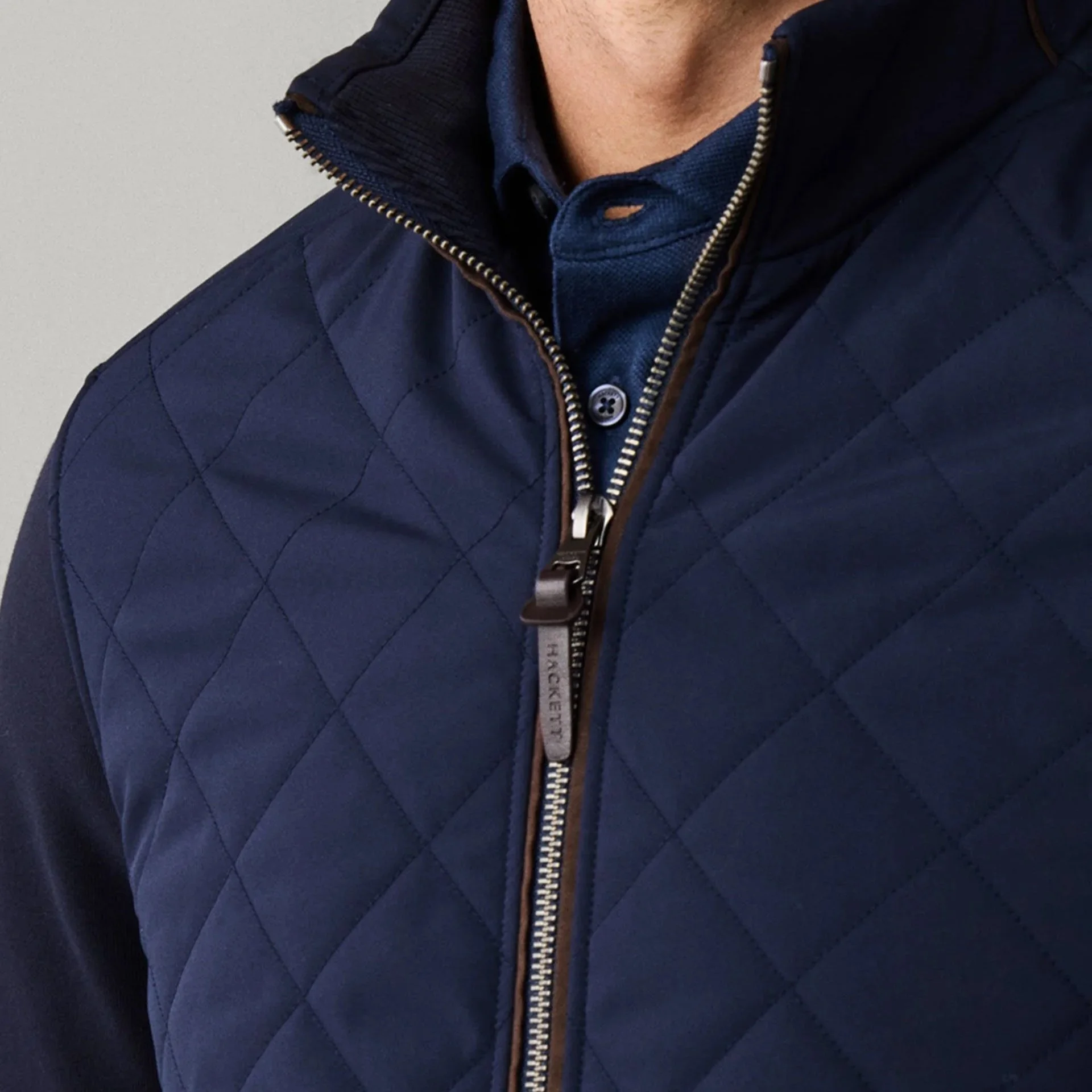 Close View of Model in Hackett Full Zip Hybrid Jacket in Navy