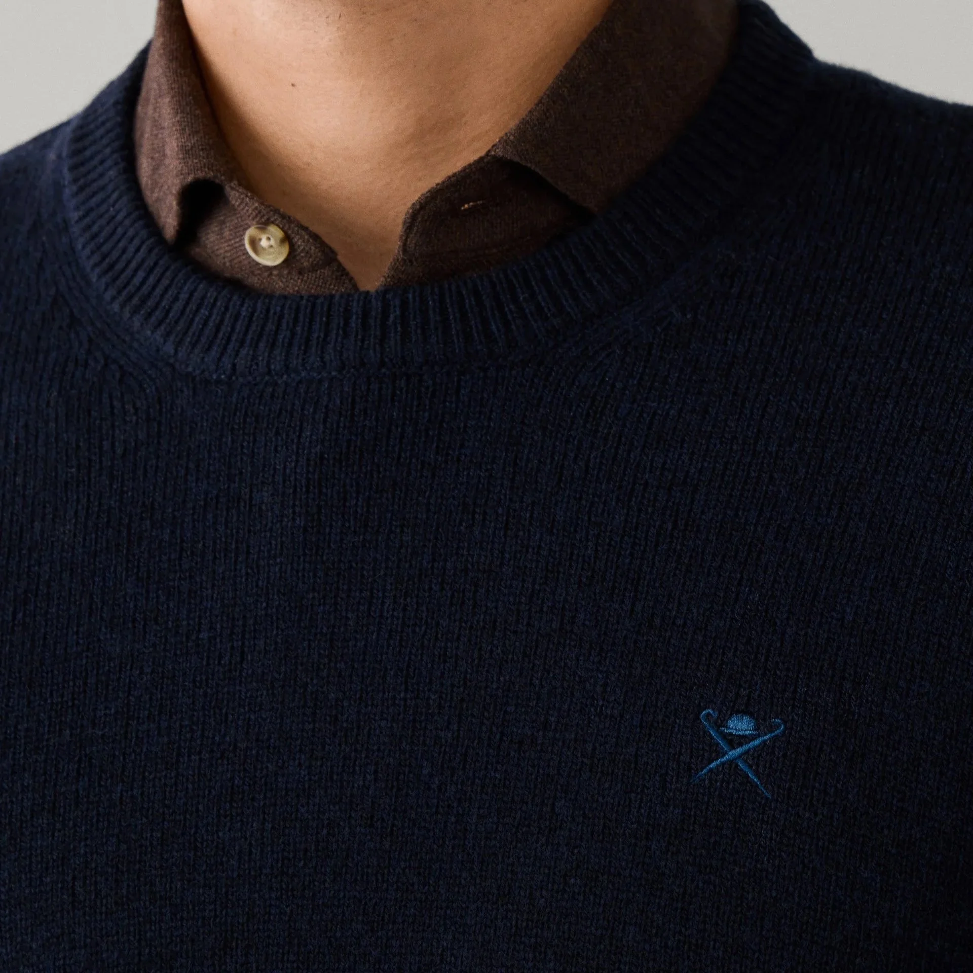 Close View of Model in Hackett Lambswool Crew Neck Jumper in Navy