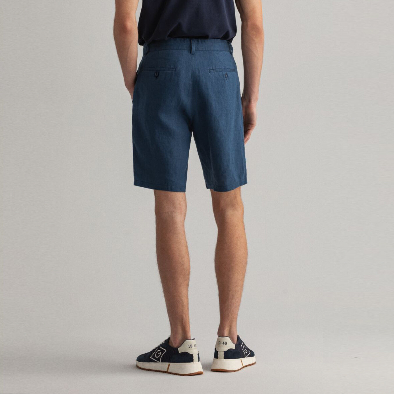 Back view of model wearing GANT Relaxed-Fit Linen Drawstring Shorts in Navy (Copy)