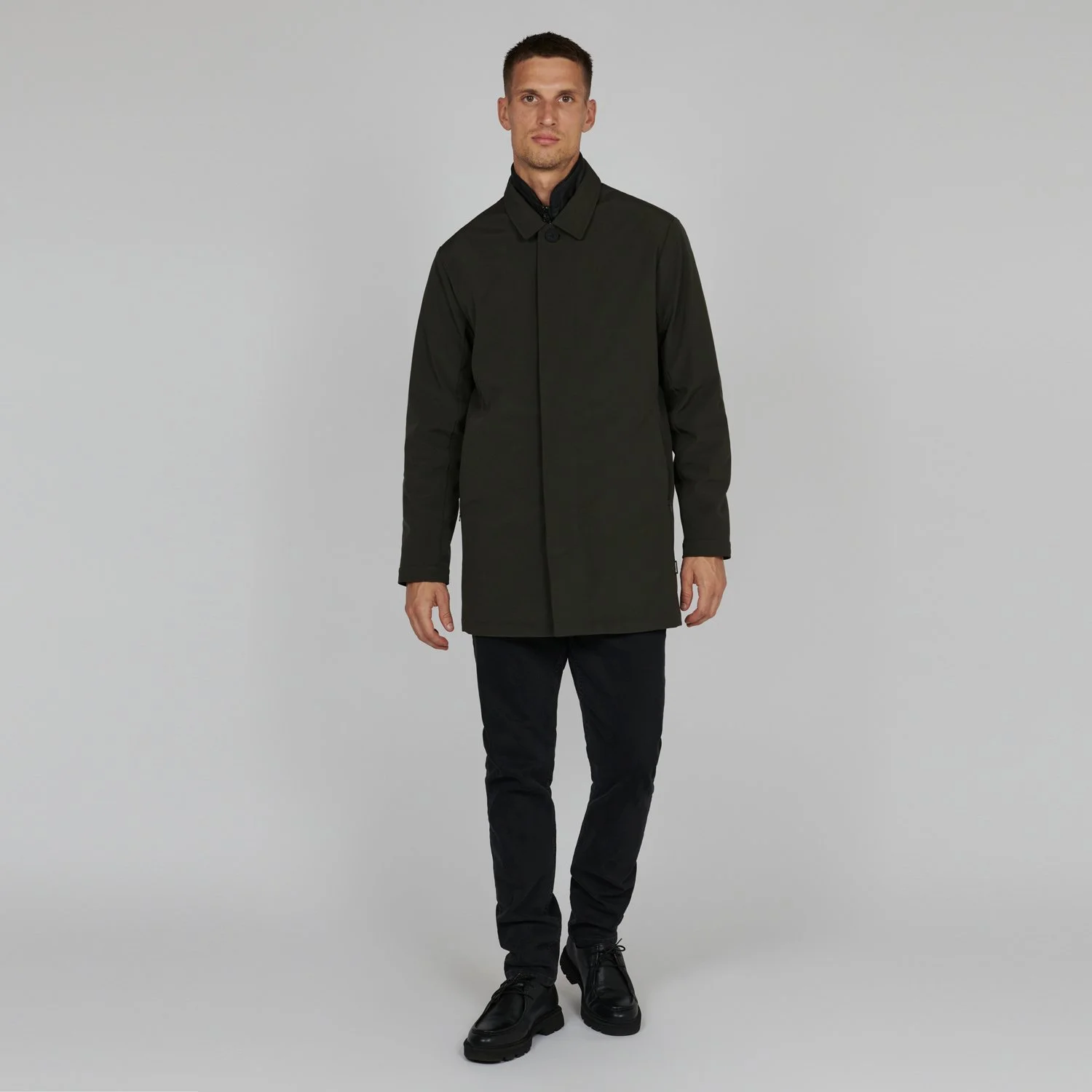 Full length view of model wearing Matinique Philman Coat in Olive