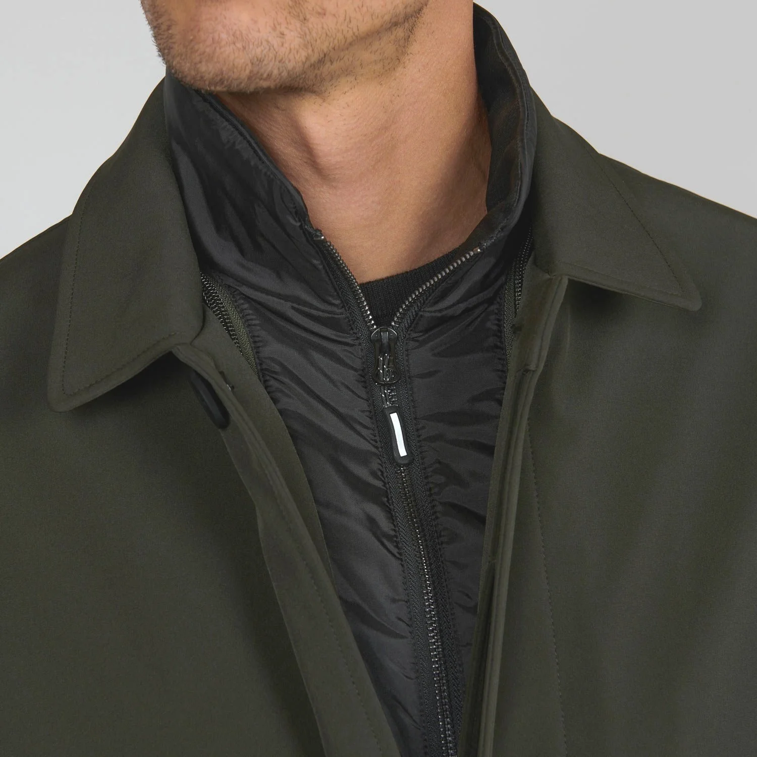 Close up view of model wearing Matinique Philman Coat in Olive