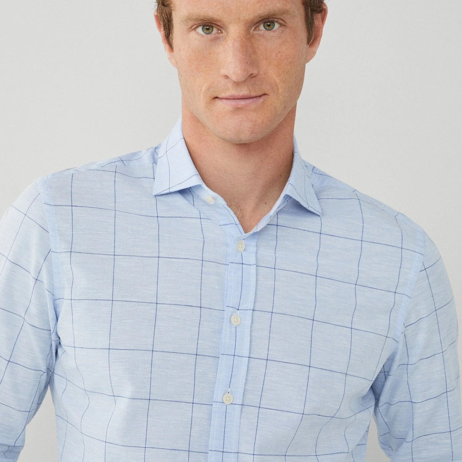 Close up View of Model in Hackett Linen Mix Check Shirt in Light Blue and Navy