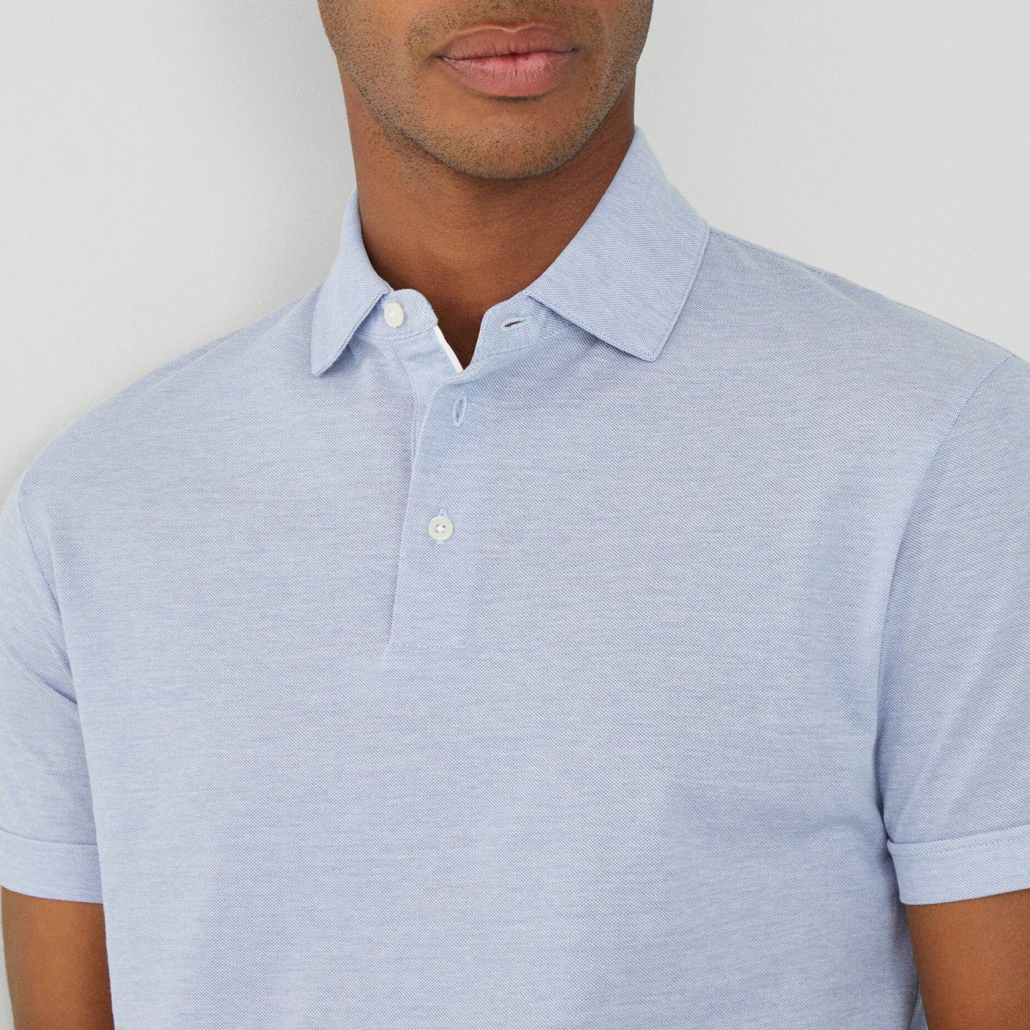 Close View of Model in Hackett Mercerised Polo in Light Blue