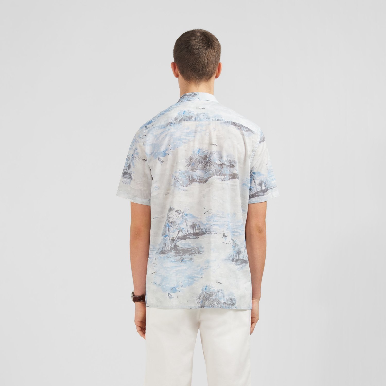 Back View of Model in Eden Park Short Sleeve Slim Fit Pattern Shirt in White Blue