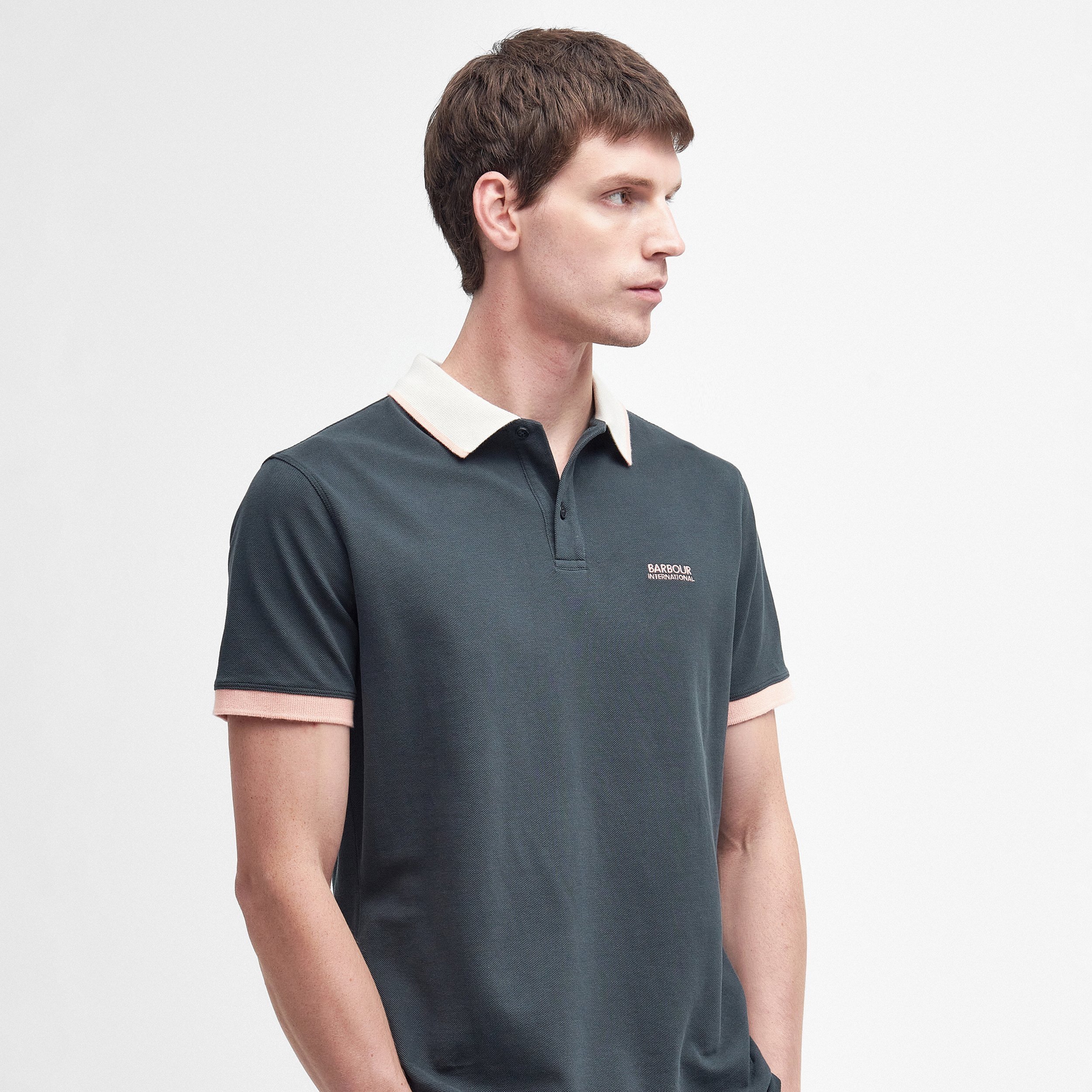 Full View of Model in Barbour International Contrast Collar Polo in Dark Green