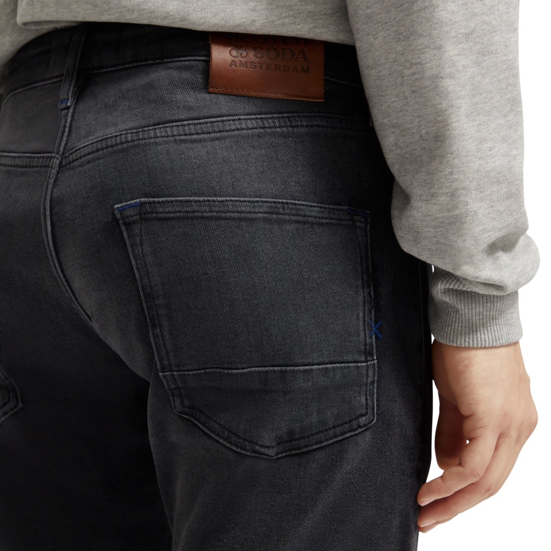 Rear View of Model in Scotch & Soda Slim Fit Jean in Washed Black