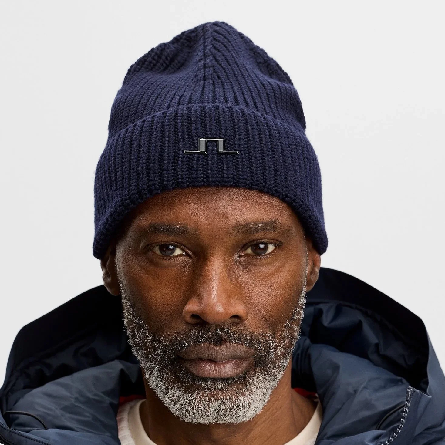 Front View of Model in J Lindeberg Merino Wool Beanie in Navy