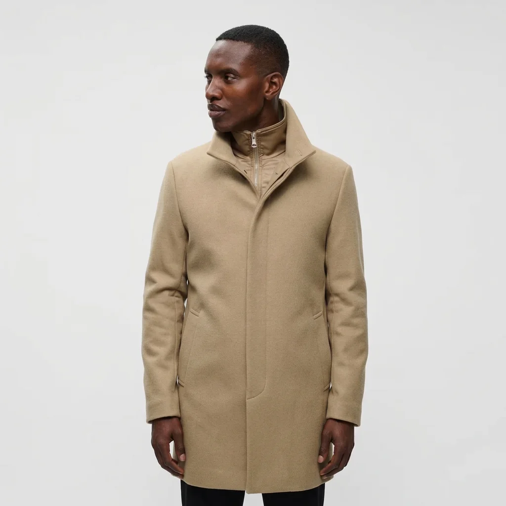 Front View of Model in Matinique Slim Fit Funnel Neck Coat in Kelp Camel