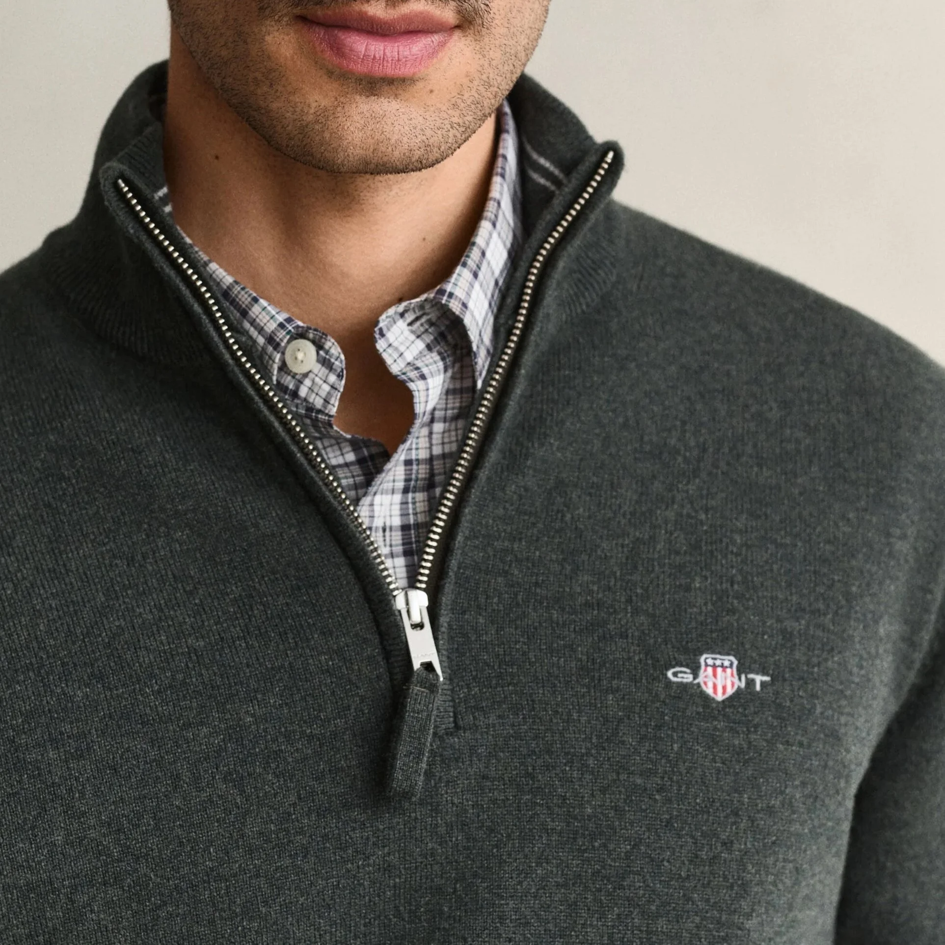 Close View of Model in GANT Superfine Lambswool Half Zip in Dark Moss Green