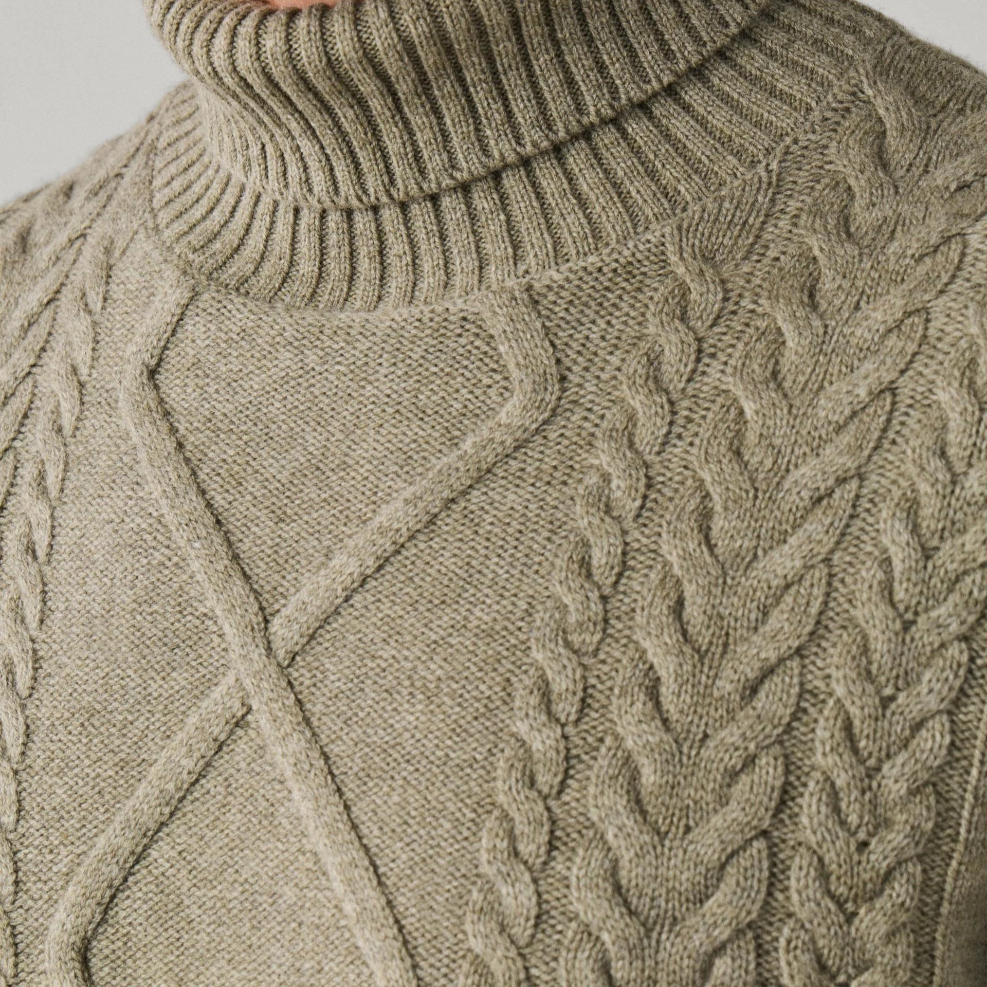 Close View of Model in Hackett Luxury Wool and Cashmere Argyle Roll Neck Jumper in Olive Green