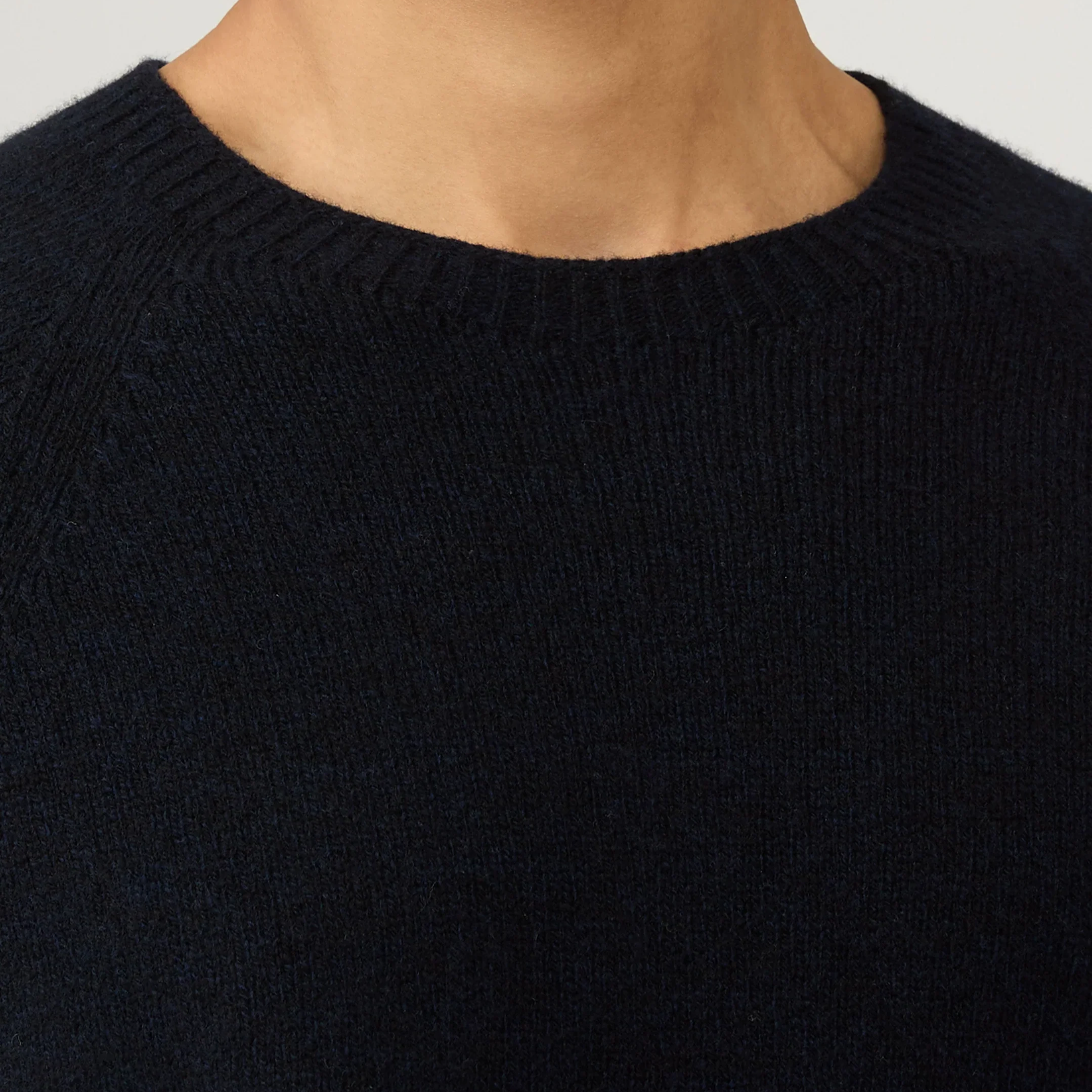 Close View of Model in Sunspel Lambswool Crew Neck Jumper in Dark Navy Mouline
