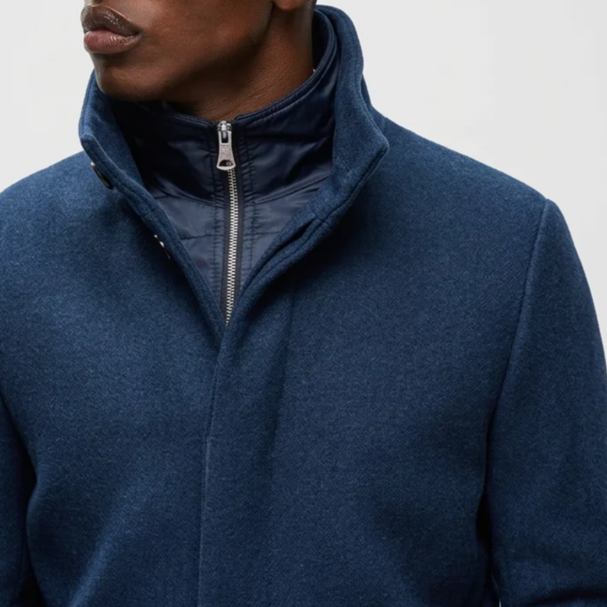 Close View of Model in Matinique Slim Fit Funnel Neck Coat in Blue Nights Denim
