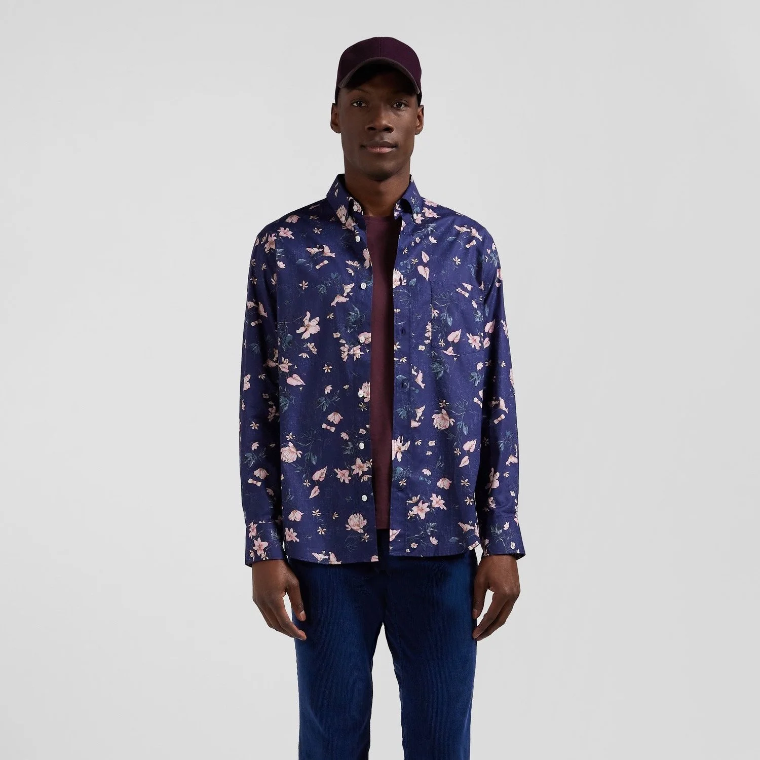 Full View of Model in Eden Park Floral Shirt in Navy and Pink