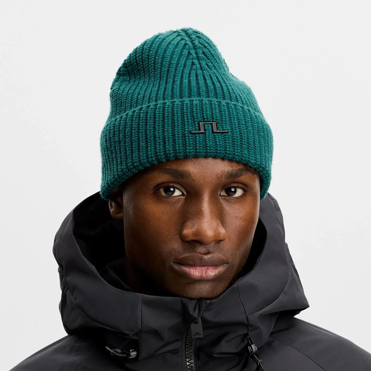 Front View of Model in J Lindeberg Merino Wool Beanie in Forest Green