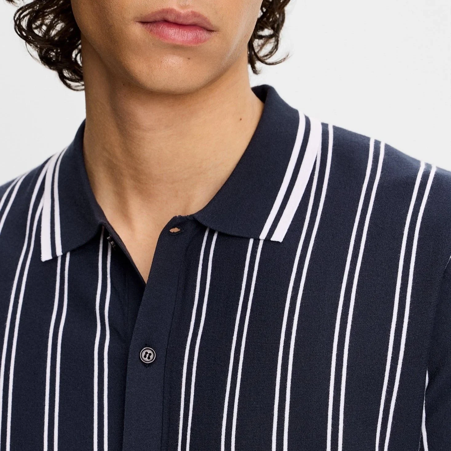 Close View of J Lindeberg Stripe Knitted Short Sleeve Shirt in Navy and White