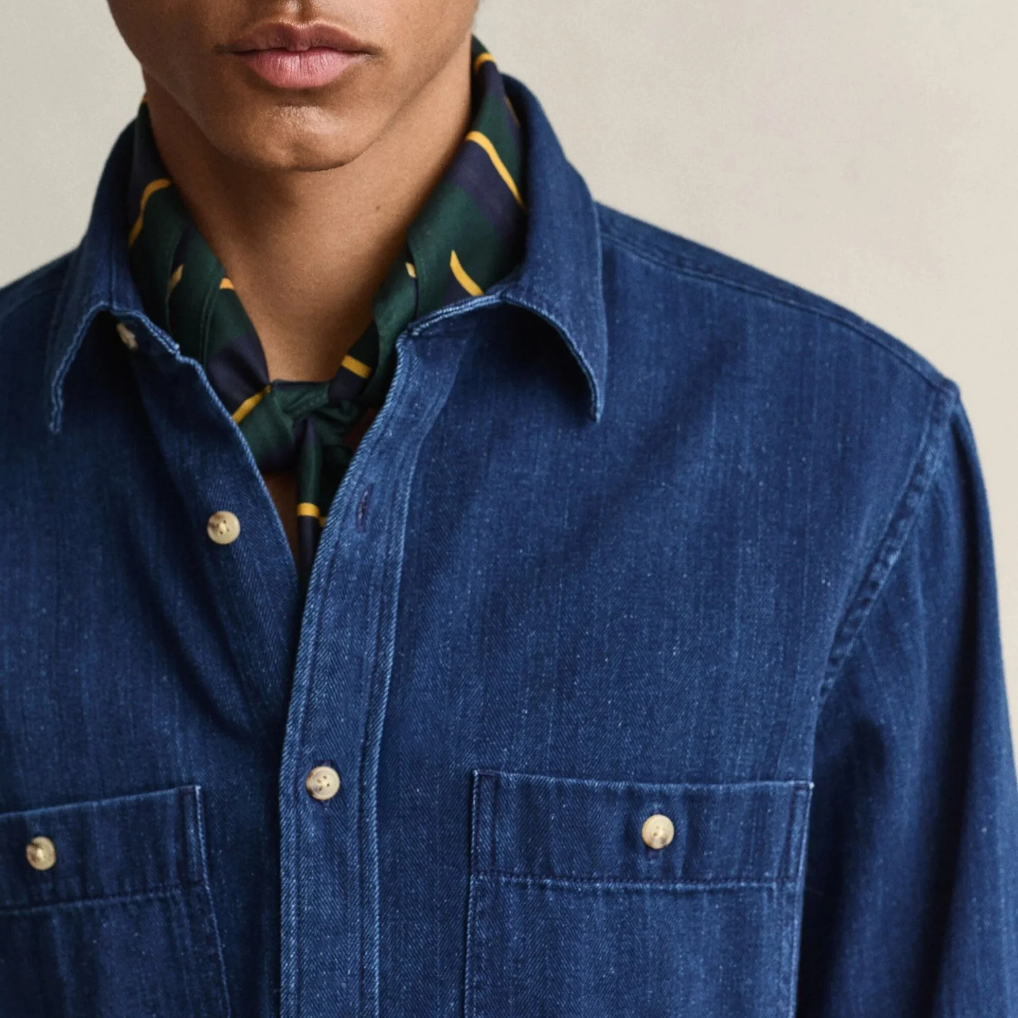 Close View of Model in GANT Regular Fit Indigo Herringbone Shirt in Mid Blue