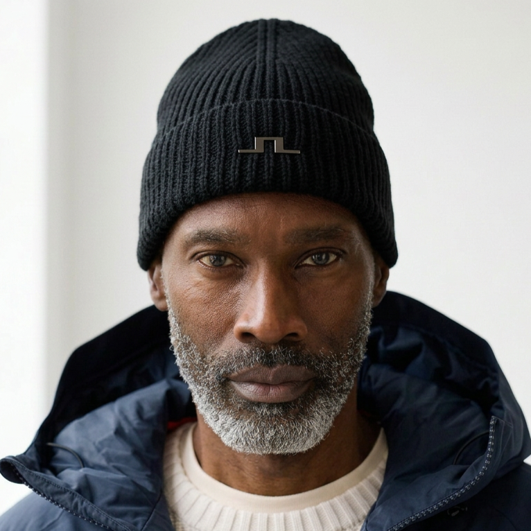 Front View of Model in J Lindeberg Merino Wool Beanie in Black