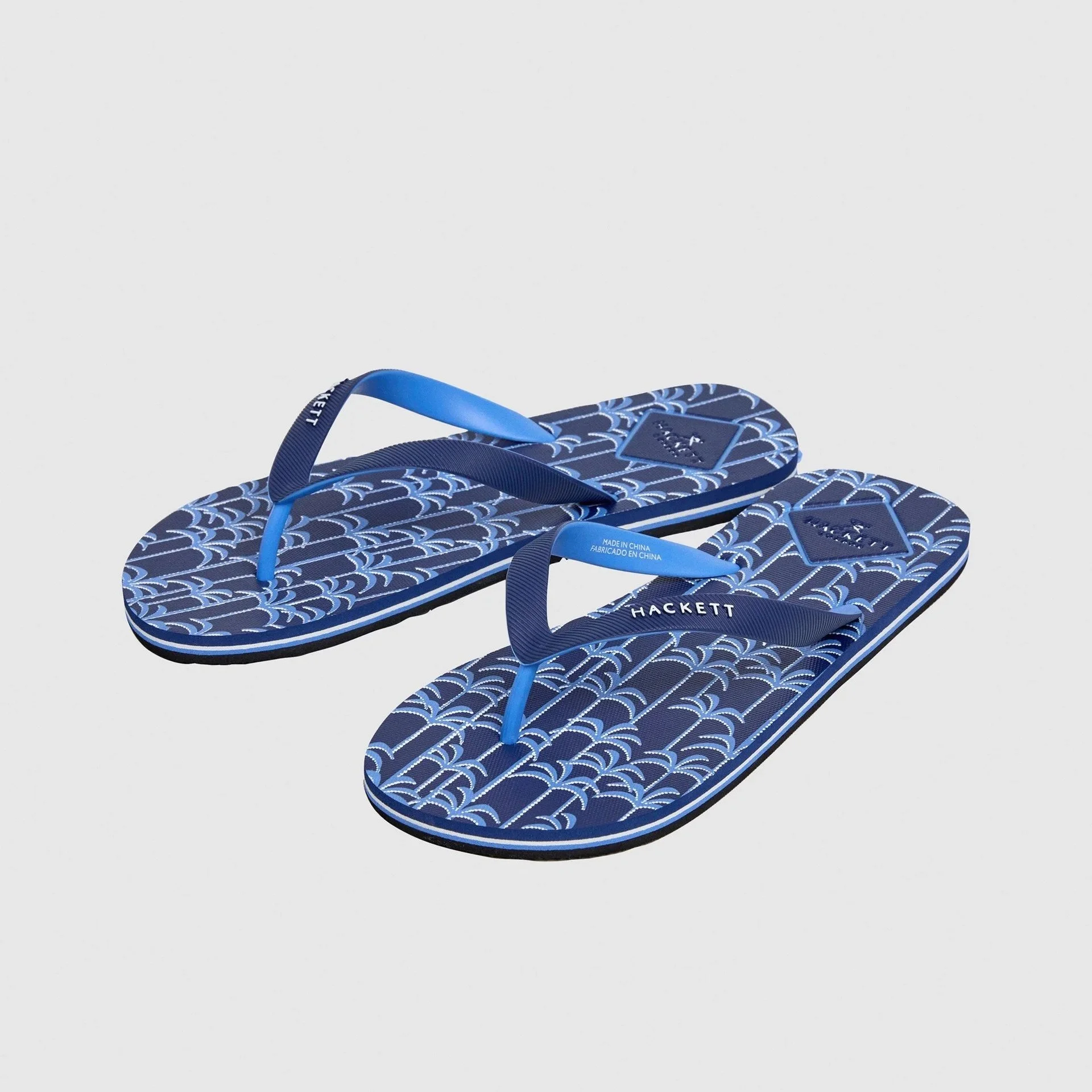 Side Pair View of Hackett Palm Tree Flip Flop in Navy