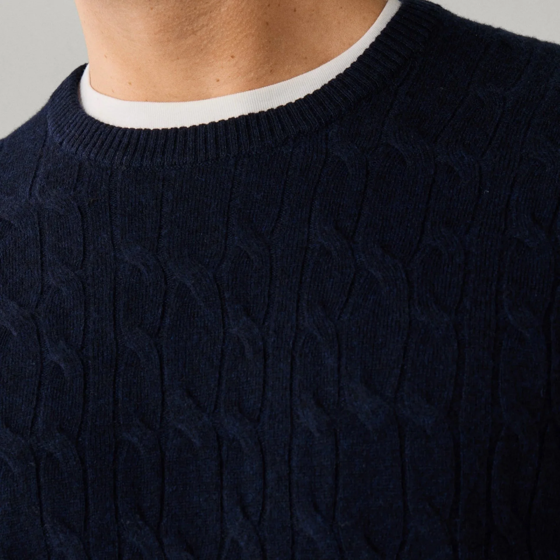 Close View of Model in Hackett Lambswool Cable Crew Neck Jumper in Navy