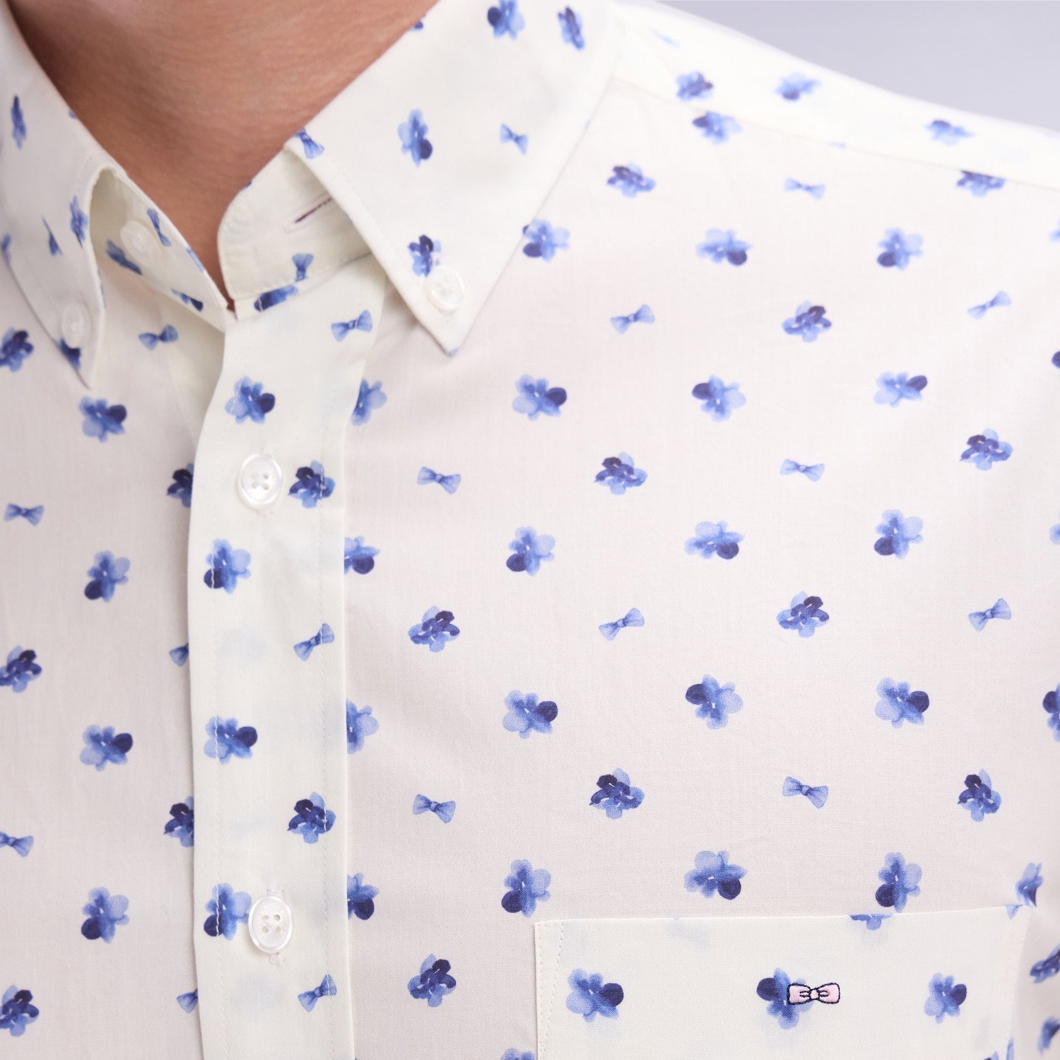 Detail View of Model in Eden Park Floral Shirt in Off White and Blue