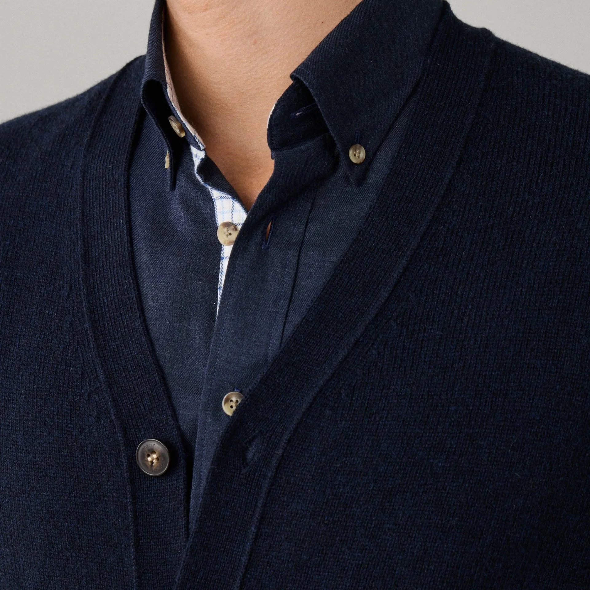 Close View of Model in Hackett Lambswool Cardigan in Navy