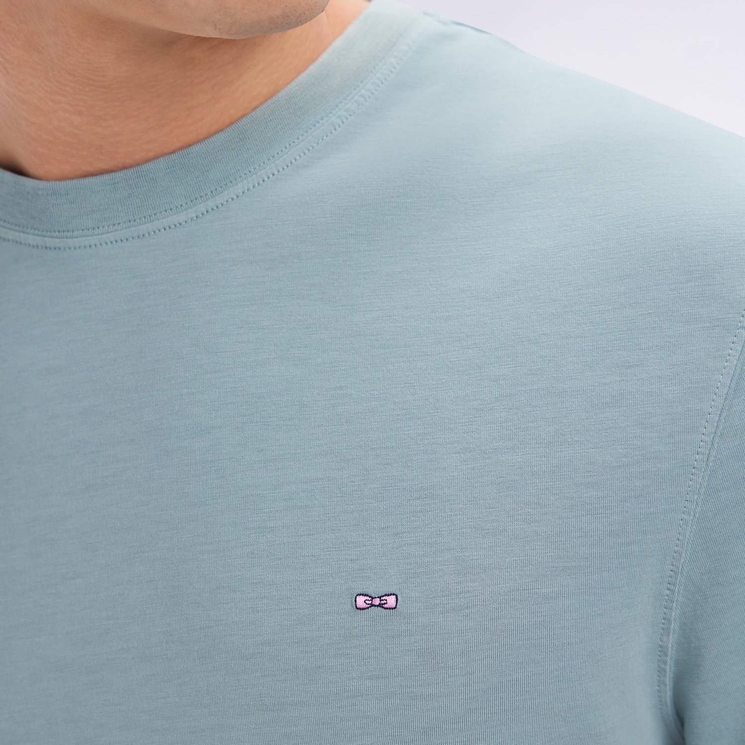 Detail View of Model in Eden Park Lightweight T Shirt in Soft Green