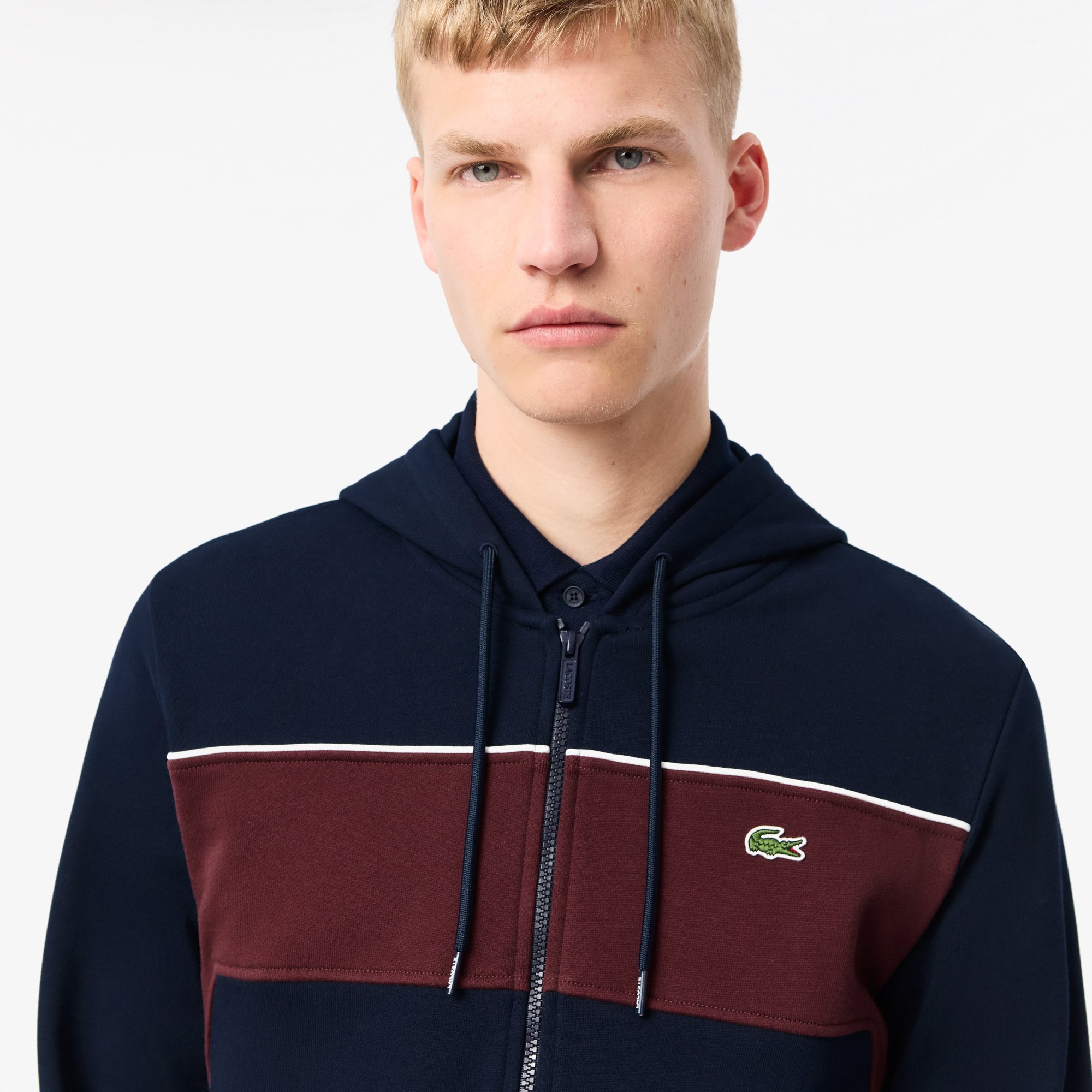 Close View of Model in Lacoste Colour Block Kangaroo Pocket Zip Hoodie in Navy and Burgundy