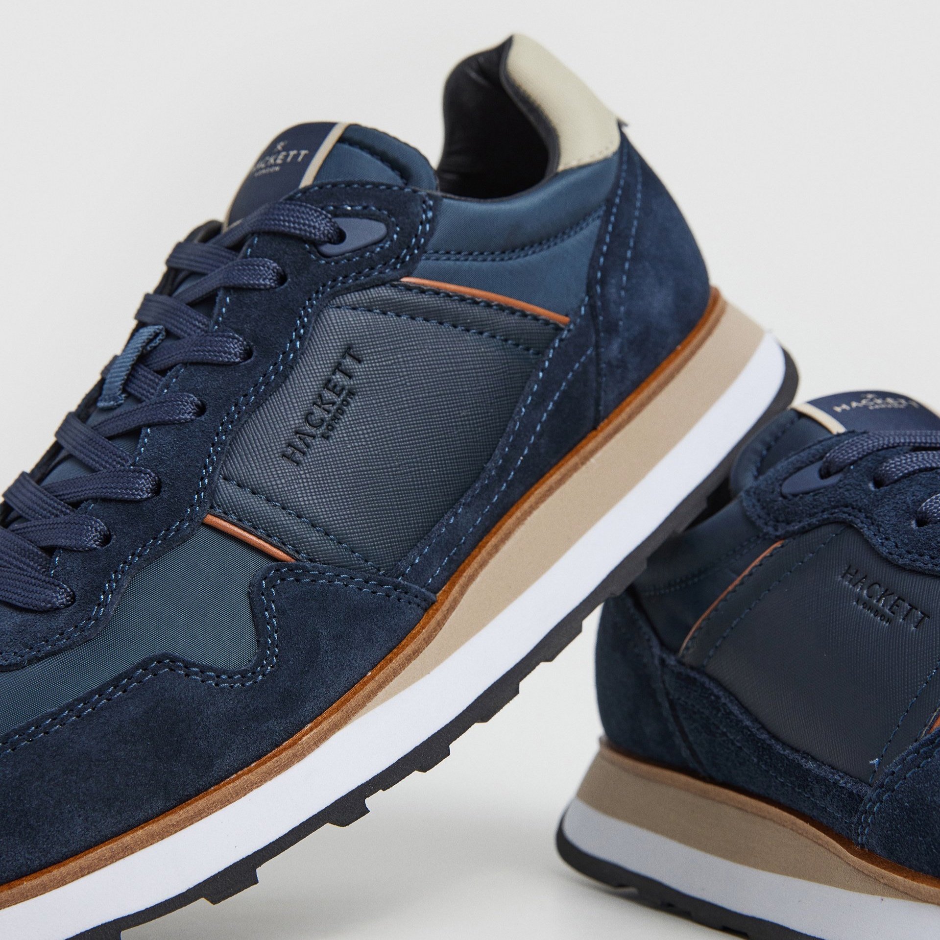 Detail View of Pair of Hackett Runner Style Trainer in Navy and Sand