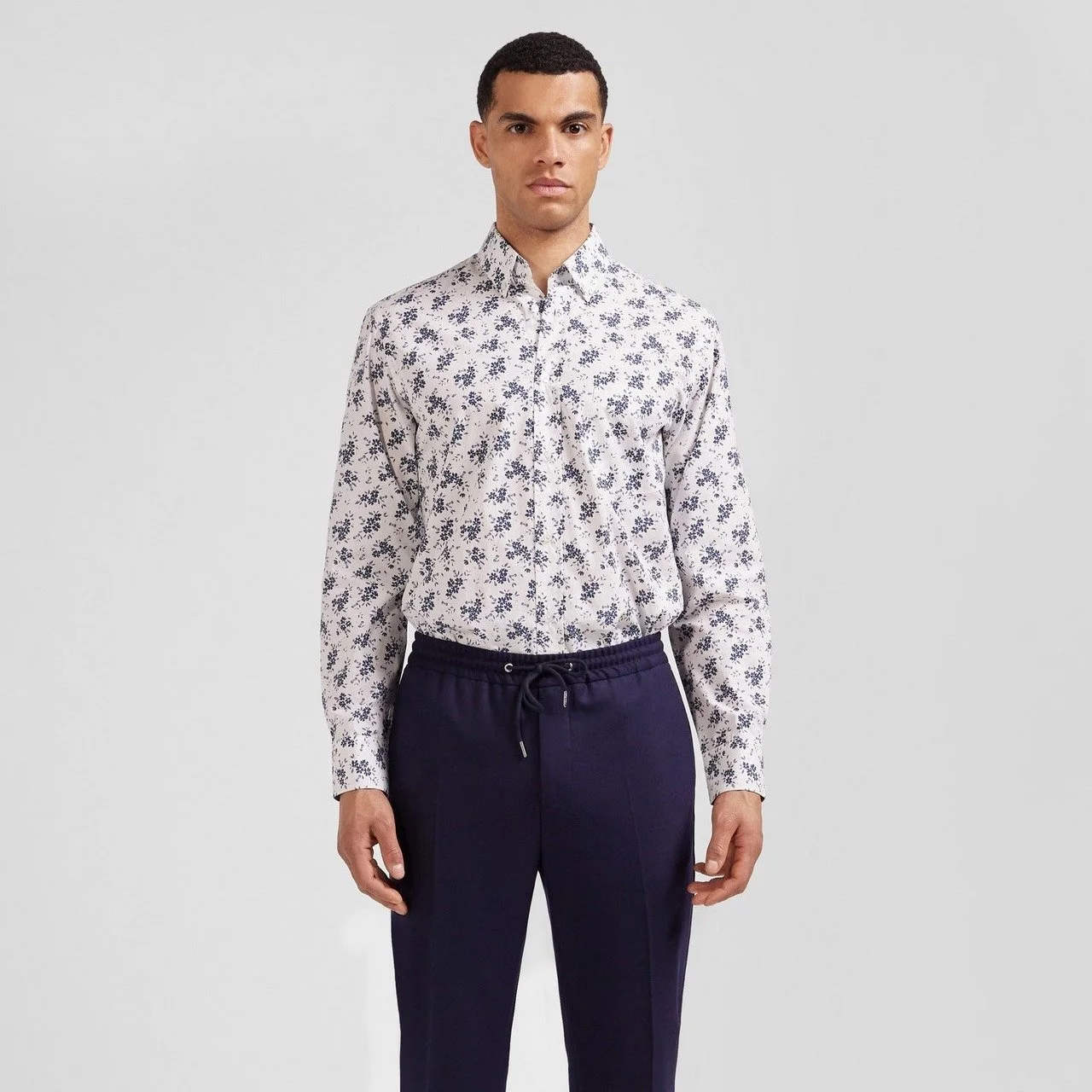 Full View of Model in Eden Park Floral Shirt in White and Blue