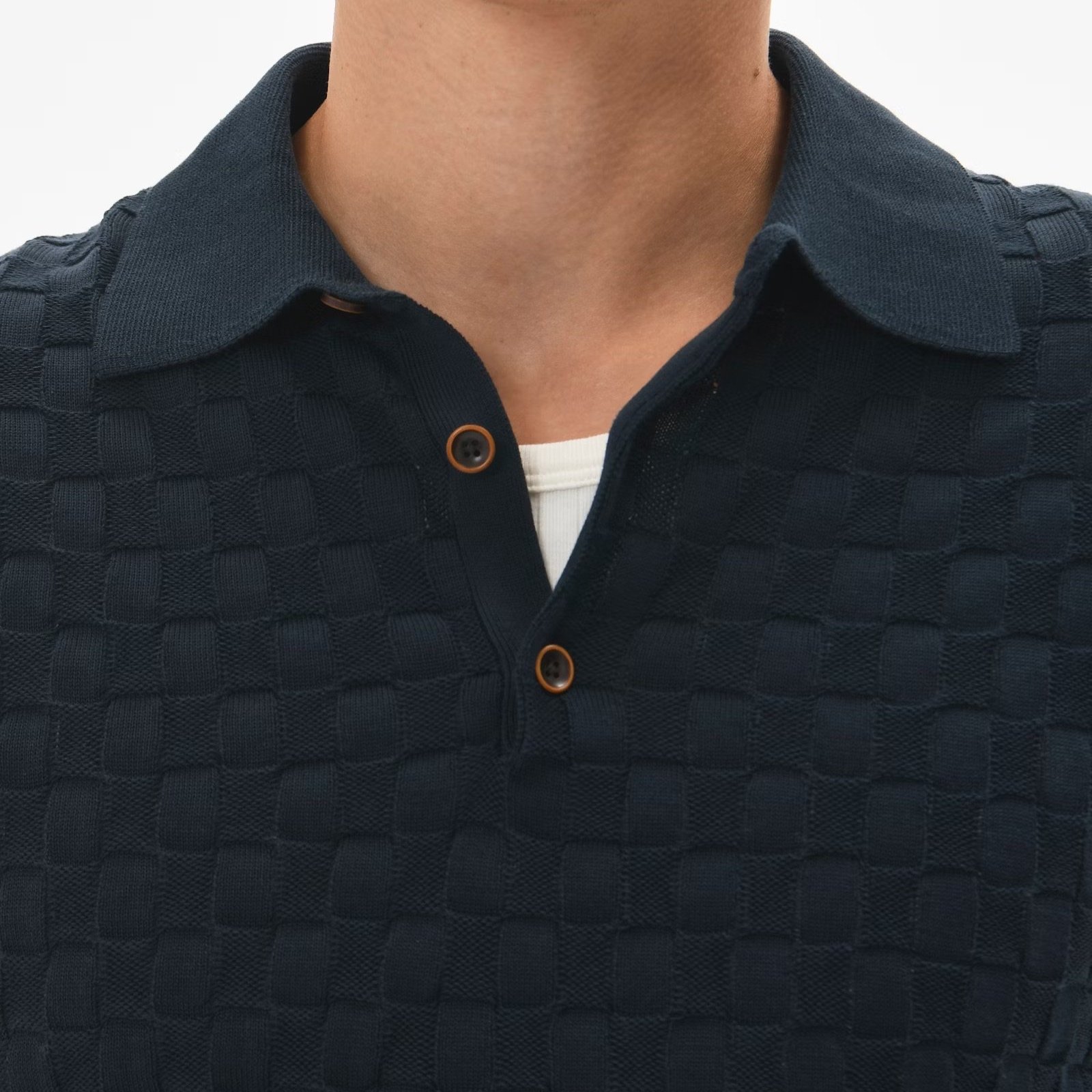 Close View of Model in Matinique Slim Fit Texture Polo in Navy