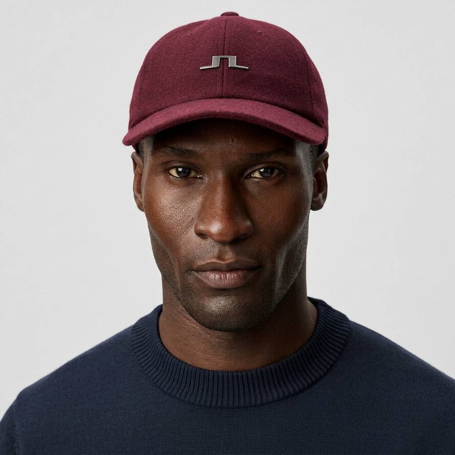 Front View of Model in J Lindeberg Winter Cap in Burgundy