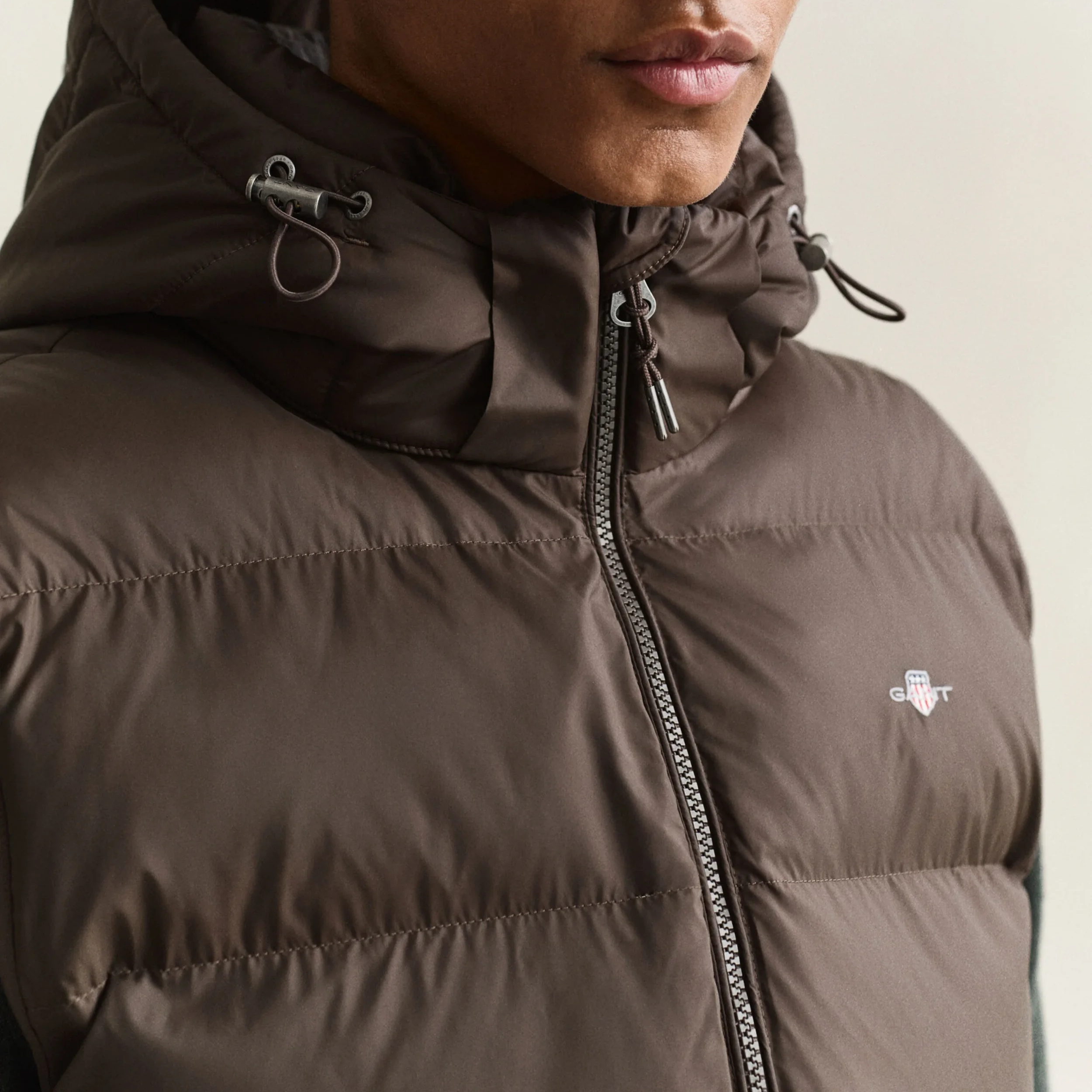 Close View of Model in GANT Active Cloud Gilet in Black Brown