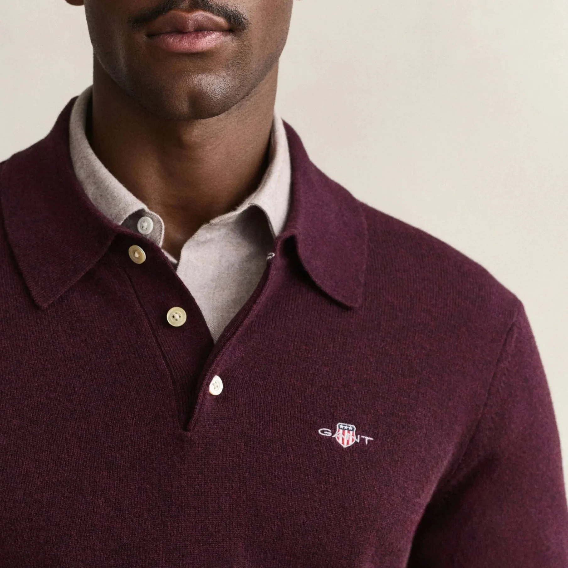 Close View of Model in GANT Superfine Lambswool Polo in Darkened Wine Burgundy