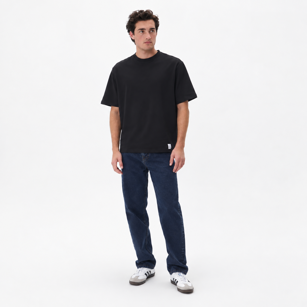 Full View of Model in Matinique Loose Fit Cotton Jeans in Dark Denim