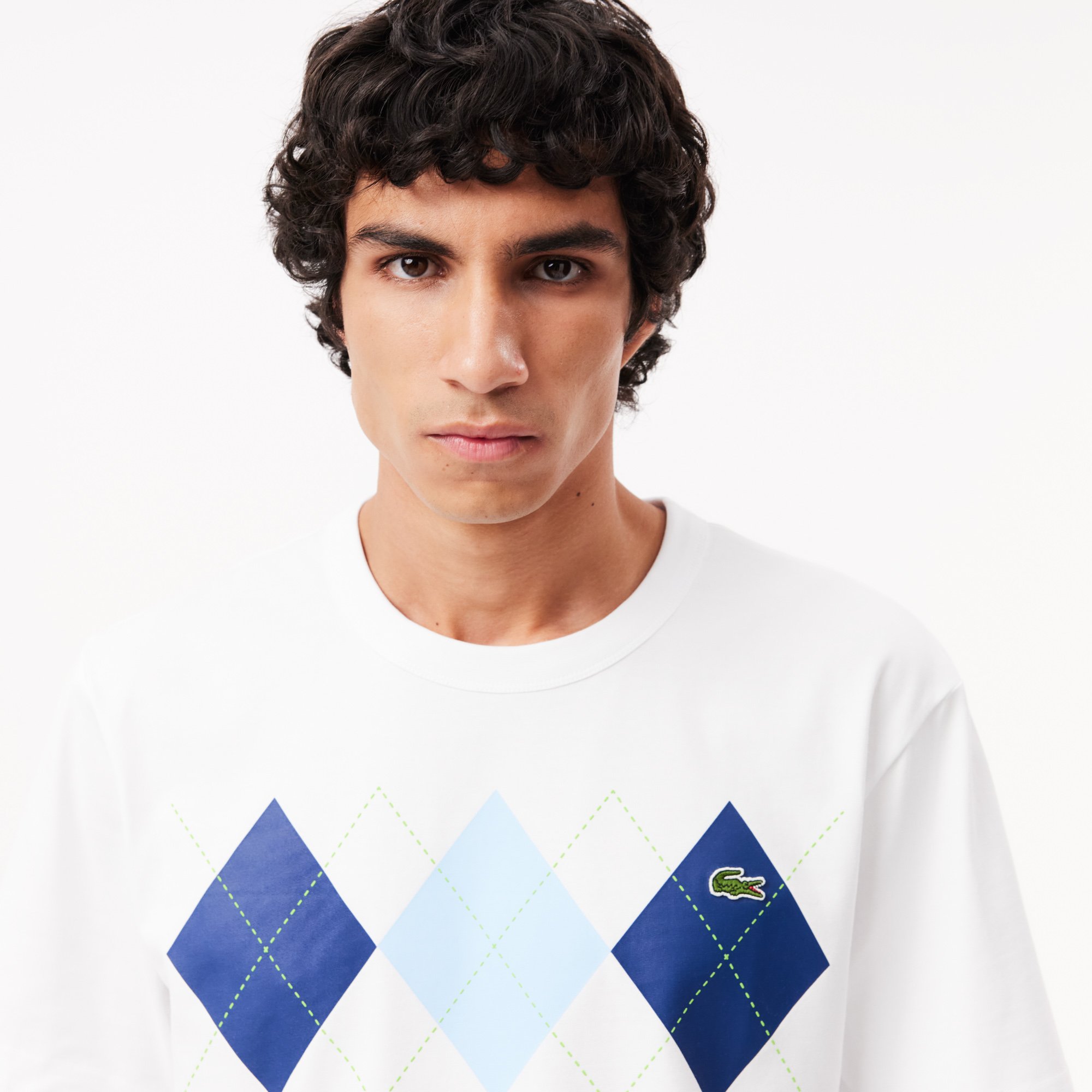 Close View of Model in Lacoste Argyle Print T Shirt in White and Blue