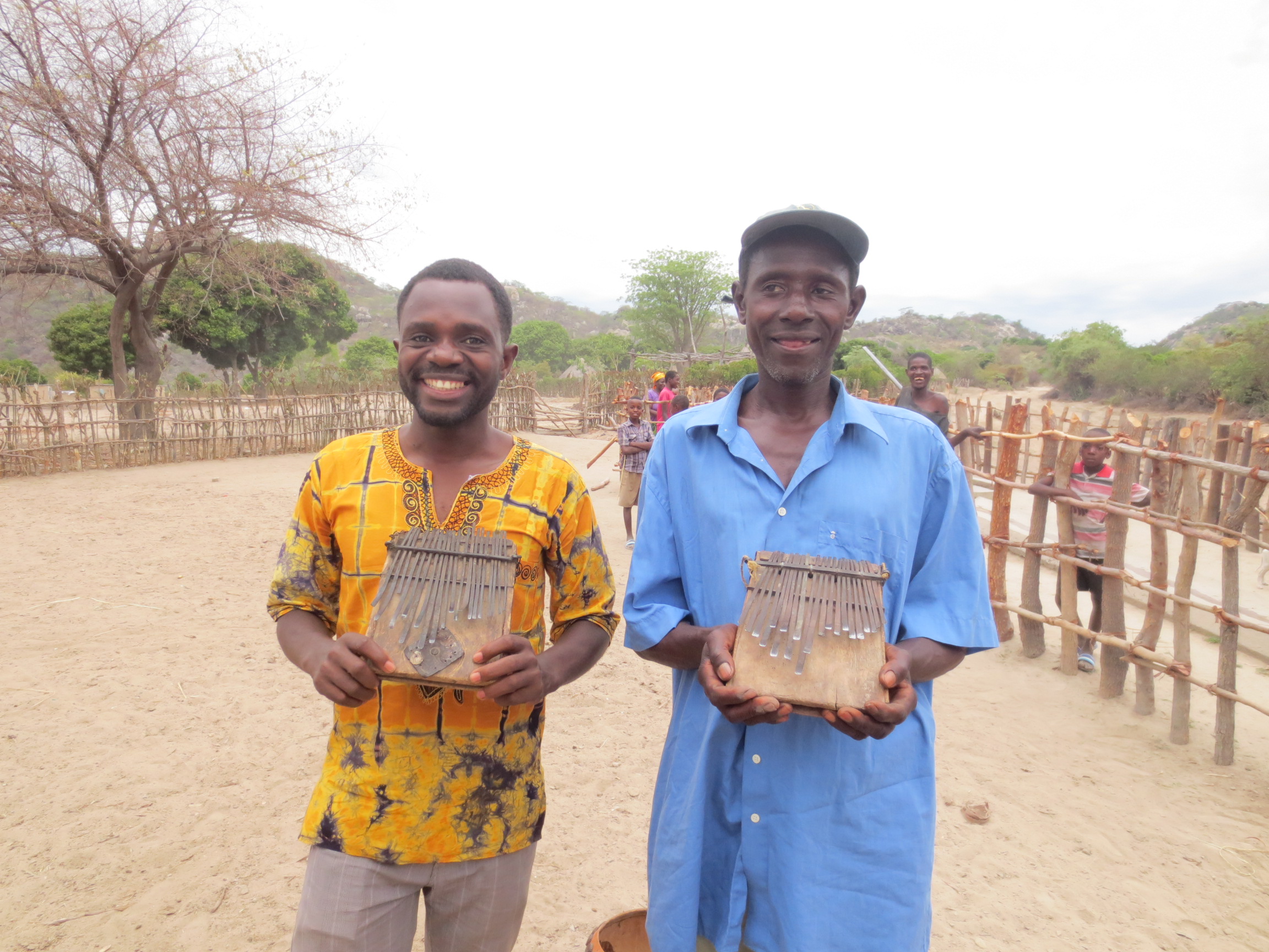 Kudakwashe Nyaruwabvu (left) and Shorai Katsukunya (right) holding madhebhe mbira