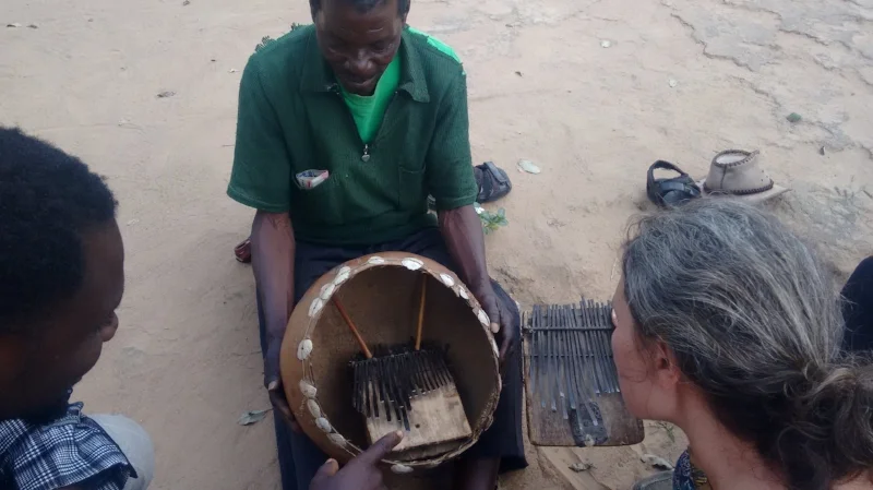Masarakufa shows us the madhebhe he built in 1968. Kuda and I compare his mbira to Partson Nyaruwabvu's madhebhe on the right. 