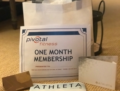 “I WORKOUT” GYM BAG Stay fit and looking great with this gym workout collection. Included are one-month Pivotal membership, $50 Athleta gift card and $15 Starbucks gift card in an Athleta carry all bag. DONOR: 3rd Grade Classes VALUE: $115