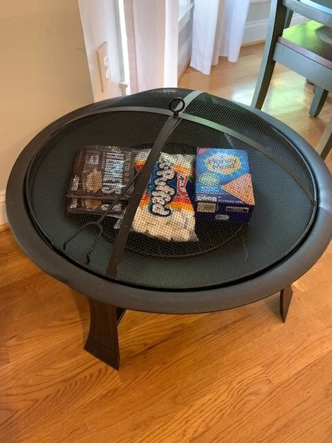 “S’MORE CAMPING” FIRE PIT This wonderful outdoor fire pit will keep you cozy along and all the fixings for some quality time with your family making yummy s’mores. DONOR: 2nd Grade Classes VALUE: $50