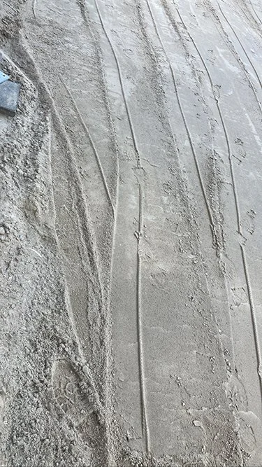  Grey gravel road tire tracks. 