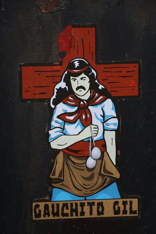 Gauchito Gil, an Argentinian "Robin Hood" who is the (informal) saint of gauchos and truck drivers