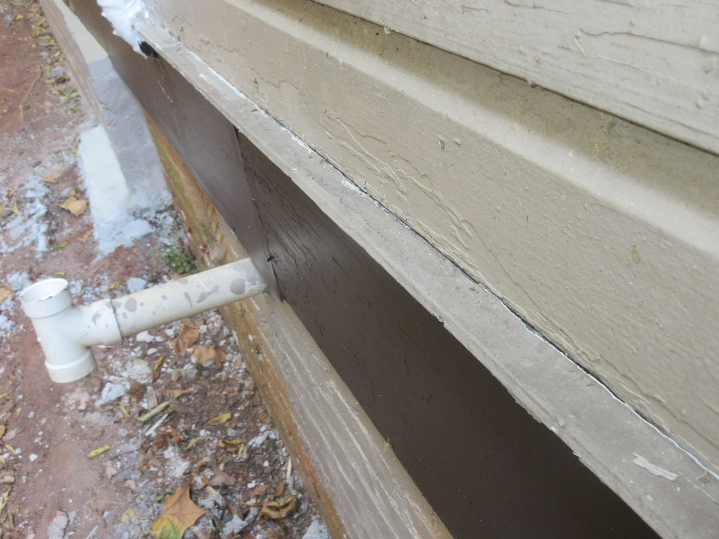 Drip edge for left side trim is angled back towards house where caulk is missing. Recommend drip edge be adjusted, properly affixed and caulked as needed.