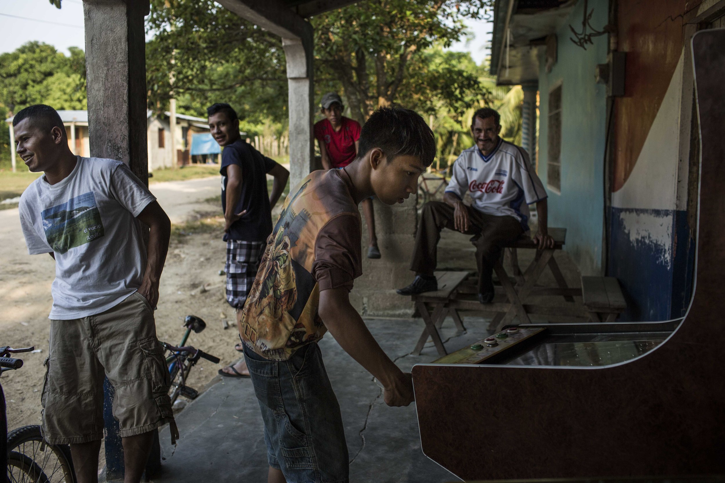 Boys in their community, outside the city of Tocoa in the department of Colon, in the Aguàn valley on the Atlantic coast of Honduras. UN Office on Drugs and Crime reported that drug traffickers in the Aguàn region allegedly contracted member of a gang denominated Mara 61 to defend their operations in the area. 