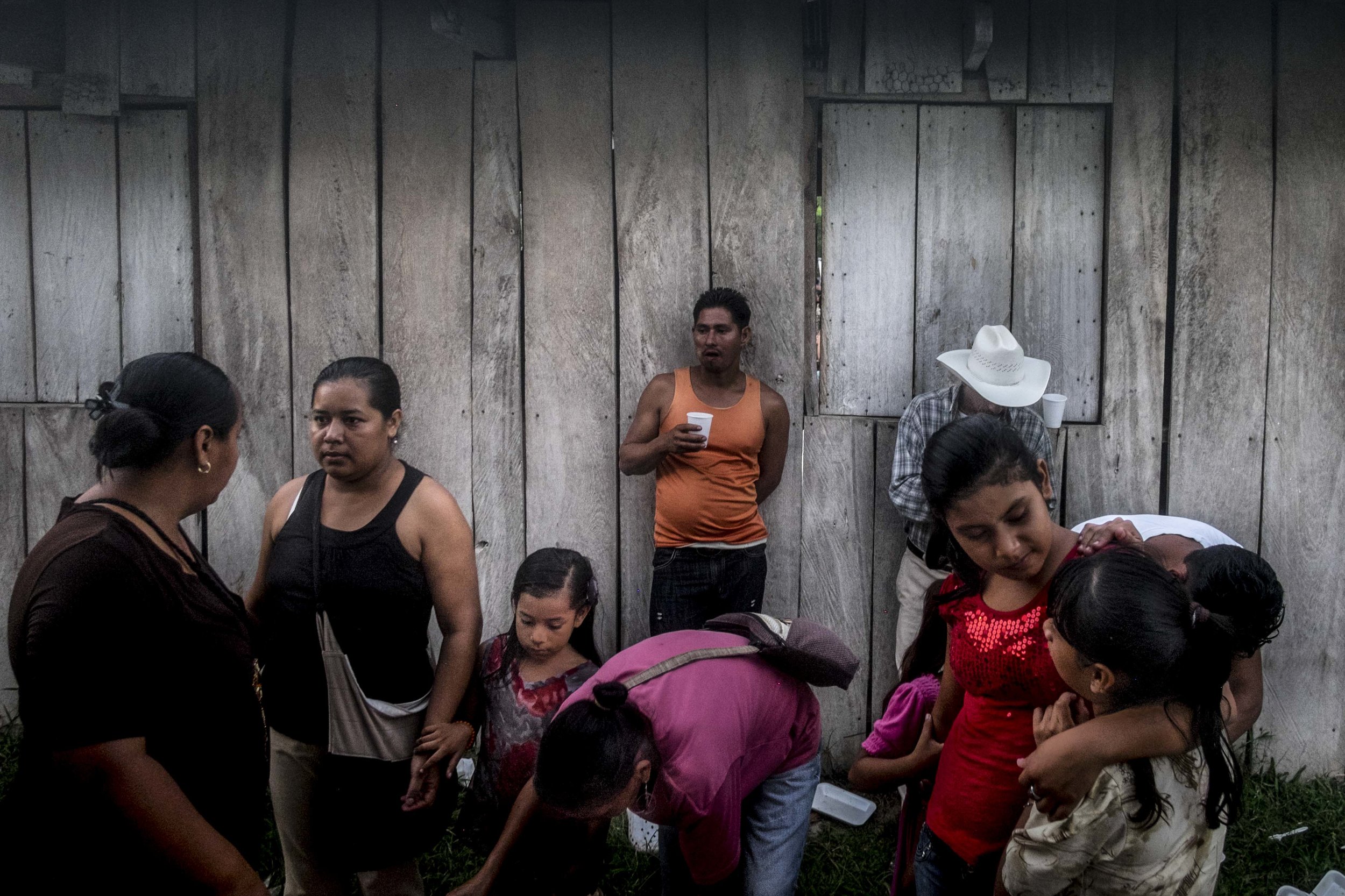  Members of the Guadalupe Carney community, outside the city of Tocoa in the department of Colon, Aguan Valley,&nbsp;Honduras. In some rural areas of the country, things are quite and murder and violence is considered a city problem. In others, like 