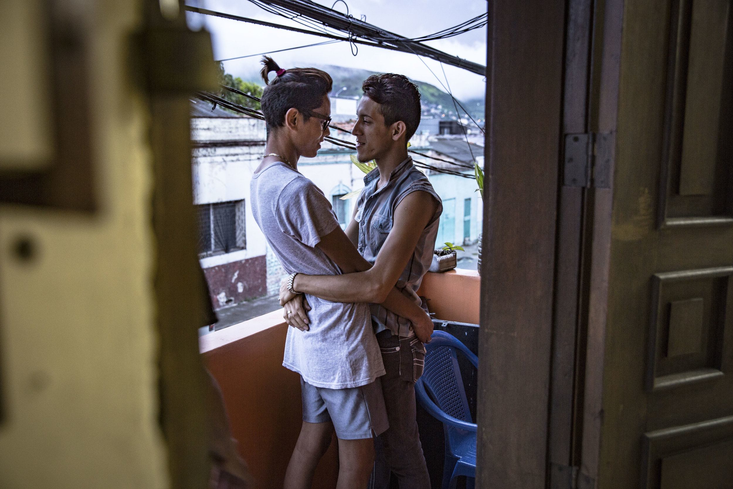A couple in the permises of Arcoiris, the LGBT organization that is a space that aims to reunite homosexuals and transgenders in Tegucigalpa in a place where they can spend time feeling relatively safe.