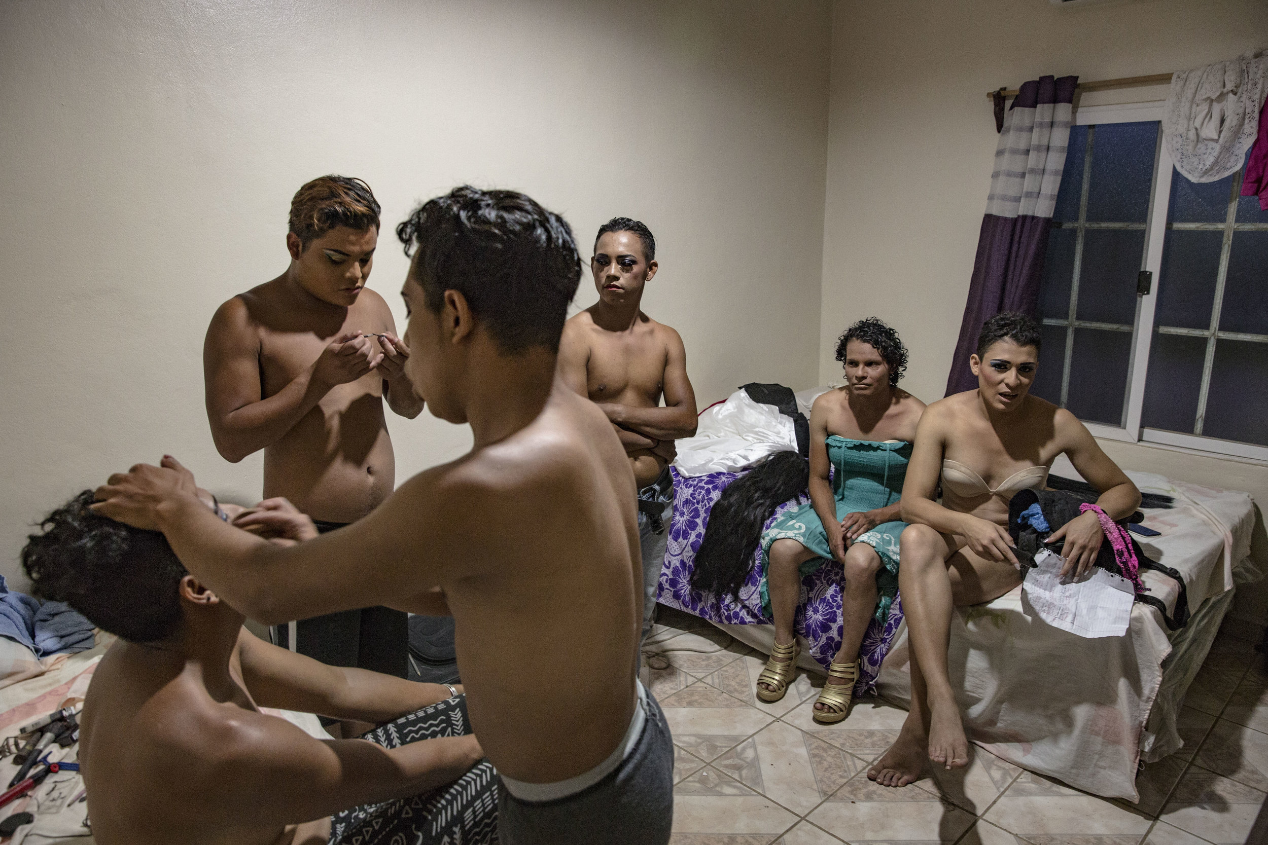  Darwin put make up onto other guys and friends, before a beauty contest for trans people in the small town of San Antonio de Cortez, in the north of Honduras. Darwin was very close to his brother. Marco was his best friend and he represented a guide